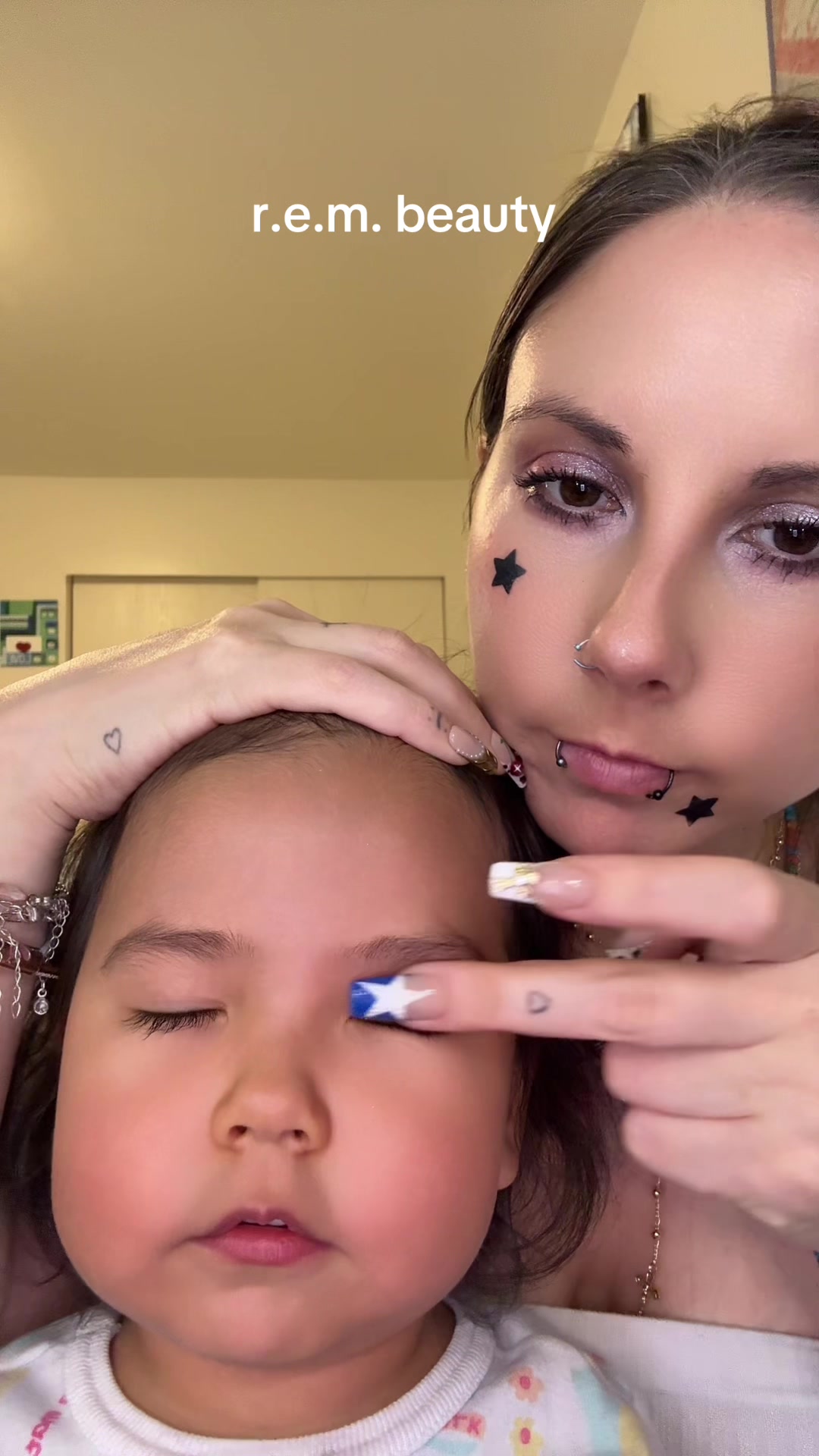 TikTok post by @katalinalynn_ for REM Beauty. Caption reads: Love love love @r.e.m. beauty  @arianagrande....