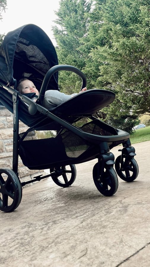 Instagram post by @trendyambitiousblonde_ for Mompush. Caption reads: [...] stroller for my toddler and infant....