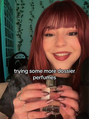TikTok post by @asmrwithsash for Dossier Perfume. Caption reads: trying more dossier perfumes! @Dossier Perfume....