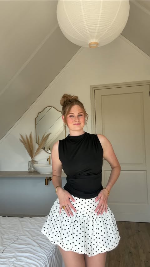 Instagram post by @marjetvdpijlx for LOAVIES. Caption reads: [...] and there 🤍⚫️ Skort & sunglasses from....