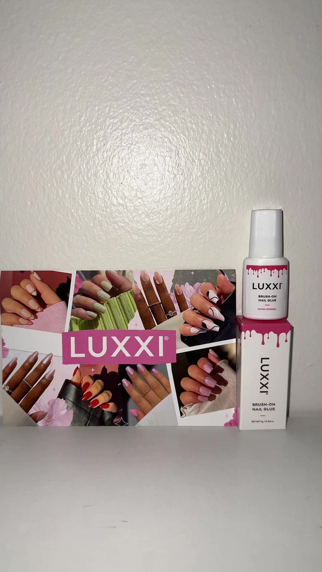 TikTok post by @pu_ja61 for Luxxi Nails. Caption reads: [...] Nail Glue for Long Lasting Wear@LUXXI NAILS....
