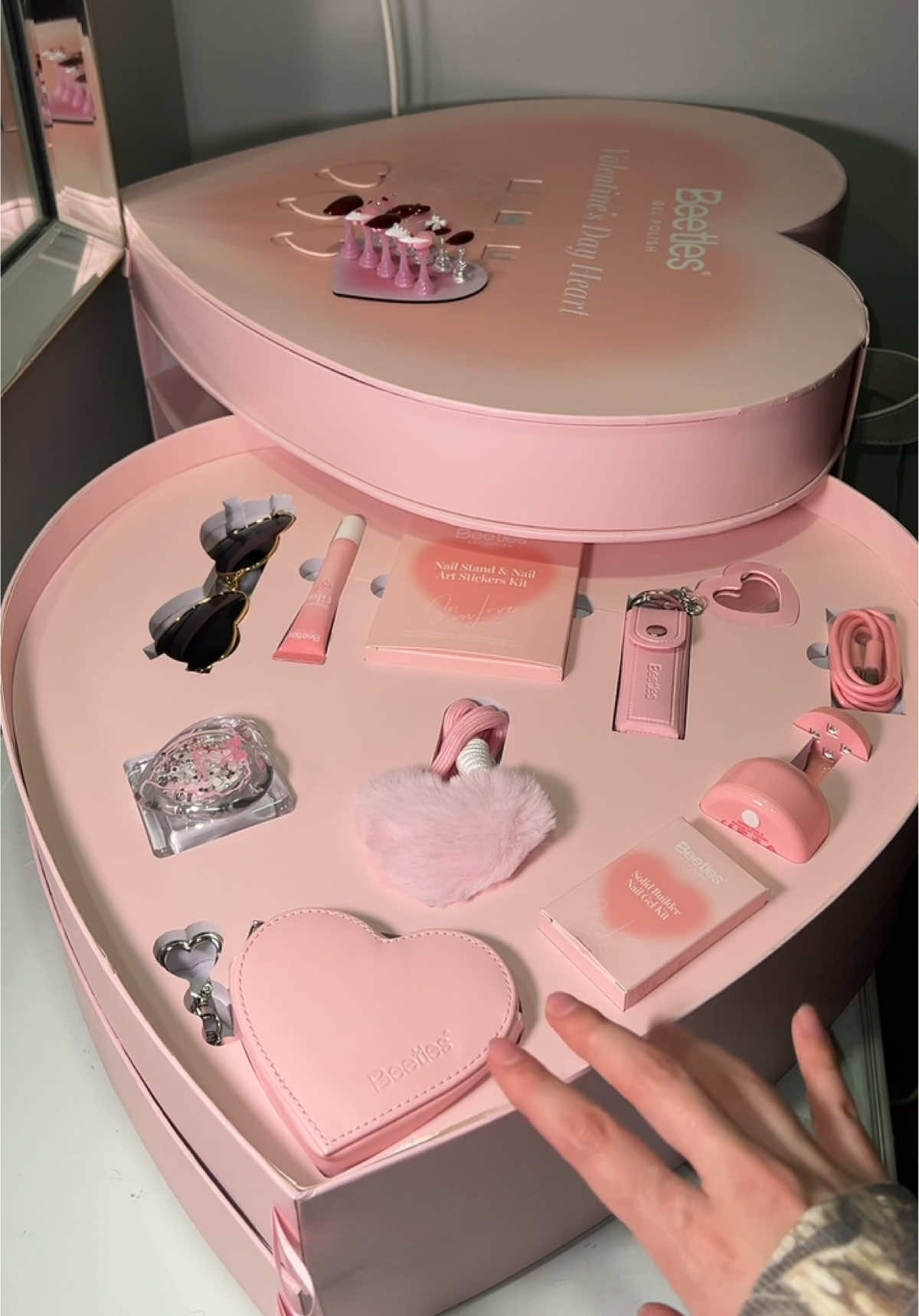 TikTok post by @real.natalia for BeetlesGelPolish. Caption reads: [...] partner. This Valentine’s Day!....