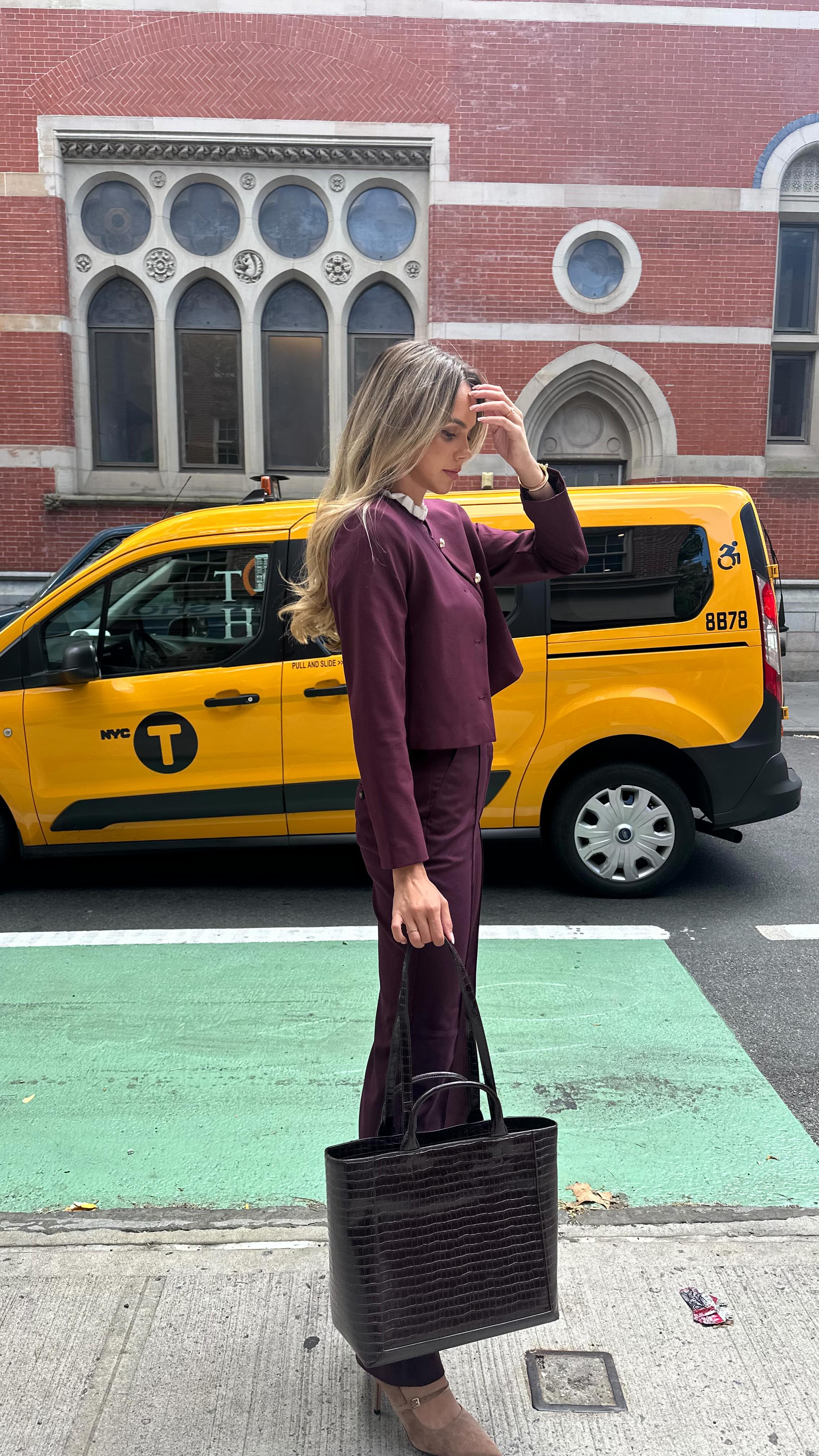 Instagram post by @wallstwardrobe for Ann Taylor. Caption reads: Corporate girl style series for fall — pants....