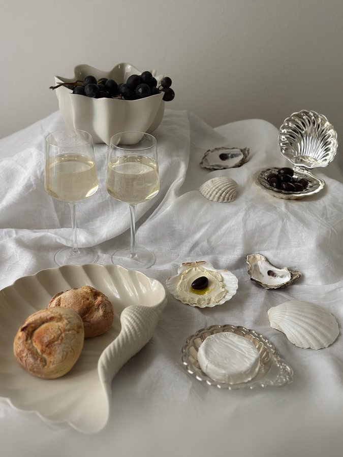 Instagram post by @interior_by_helen_wizemann for ferm LIVING. Caption reads: Bring the ocean to your table…
A seashell-inspired....