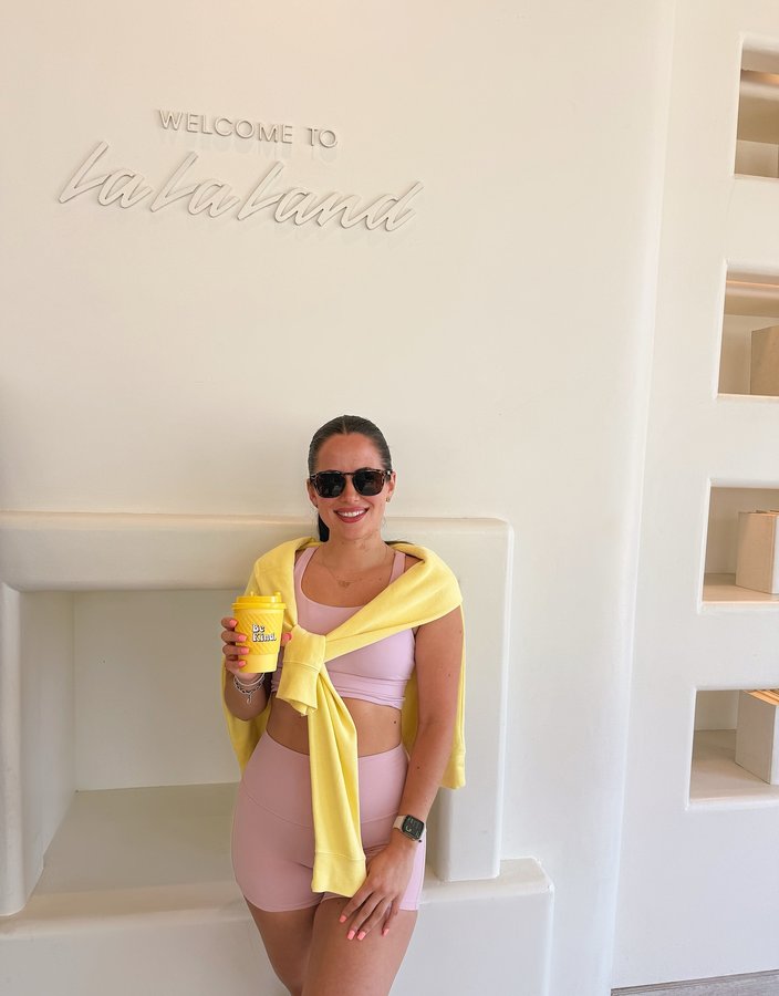 Instagram post by @_romeliia for La La Land Kind Cafe. Caption reads: In La La Land 💛💛 . . #photography #fashion....