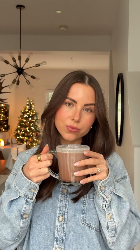 Instagram post by @lulugodin for Cowboy Colostrum. Caption reads: comment “hot chocolate” 🍫☕️ and I’ll send you the....