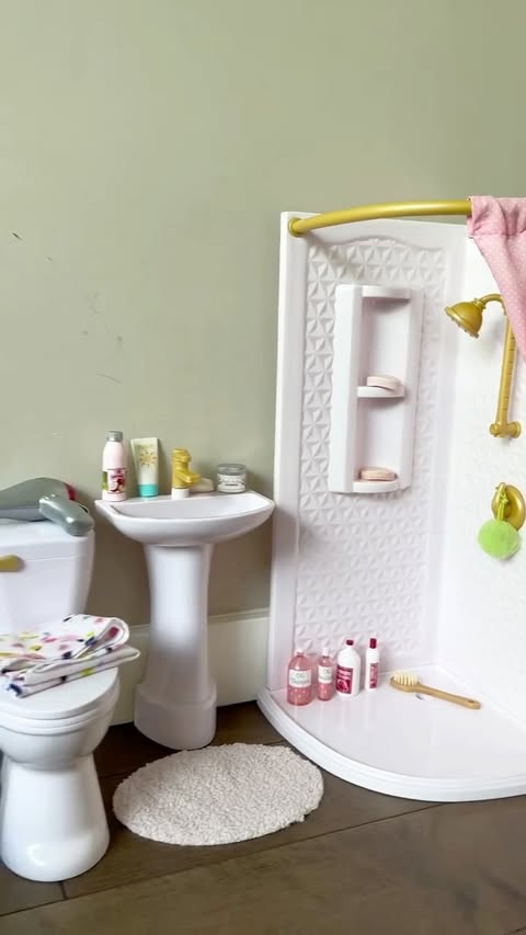 Instagram post by @defintiely for Our Generation Dolls. Caption reads: Let’s set up my mini bathroom! This set from....