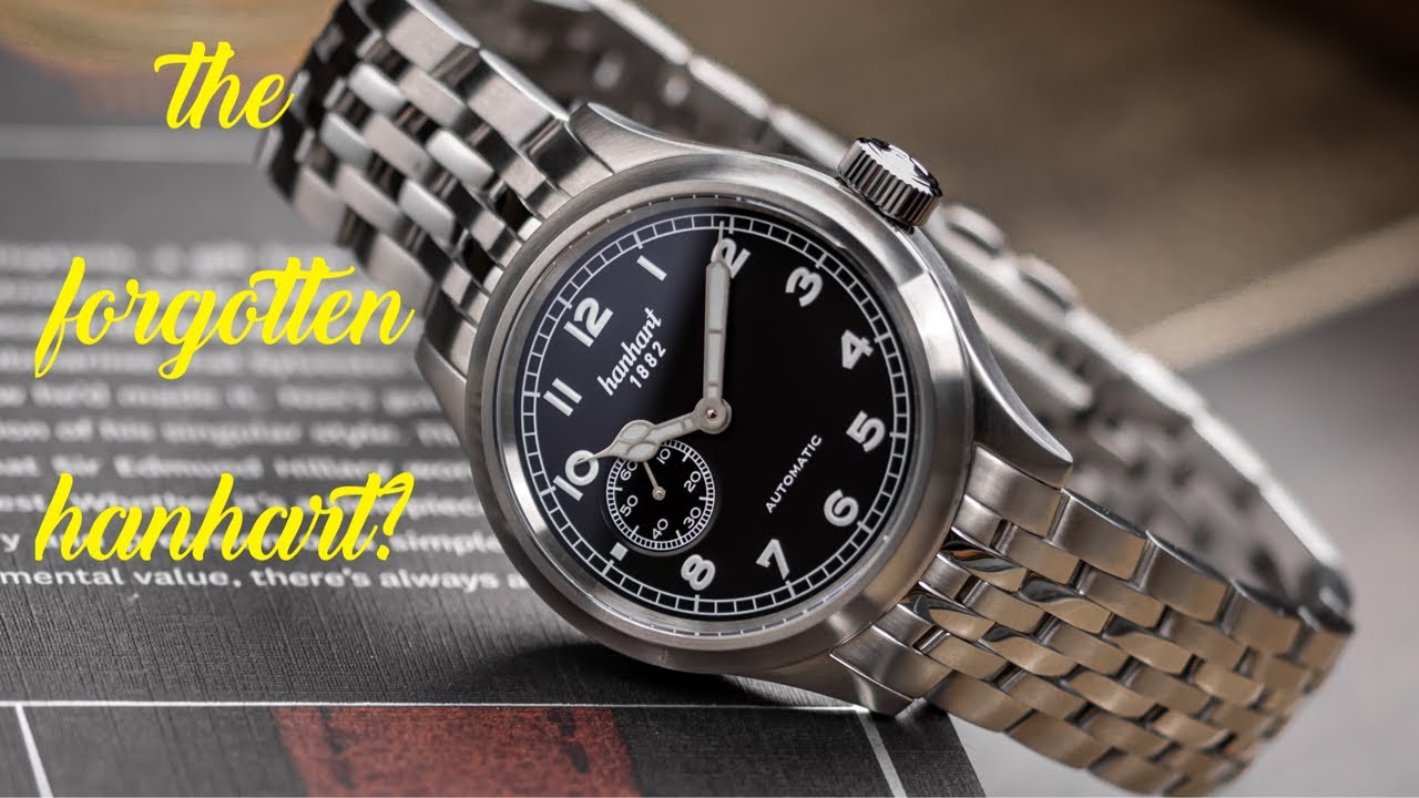 YouTube post by @watchreport for StrapsCo. Caption reads: Is the Hanhart Pioneer Preventor9 The Best Hanhart....