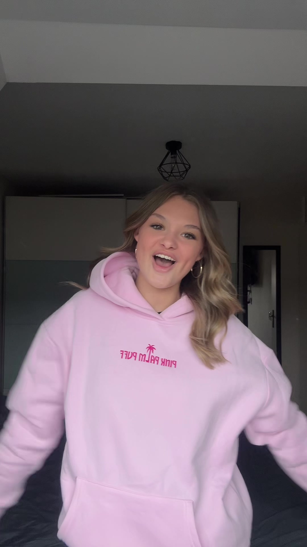 TikTok post by @kayleigh.boom for PINK PALM PUFF. Caption reads: My fave summer hoodie 🩷@PINK PALM PUFF....