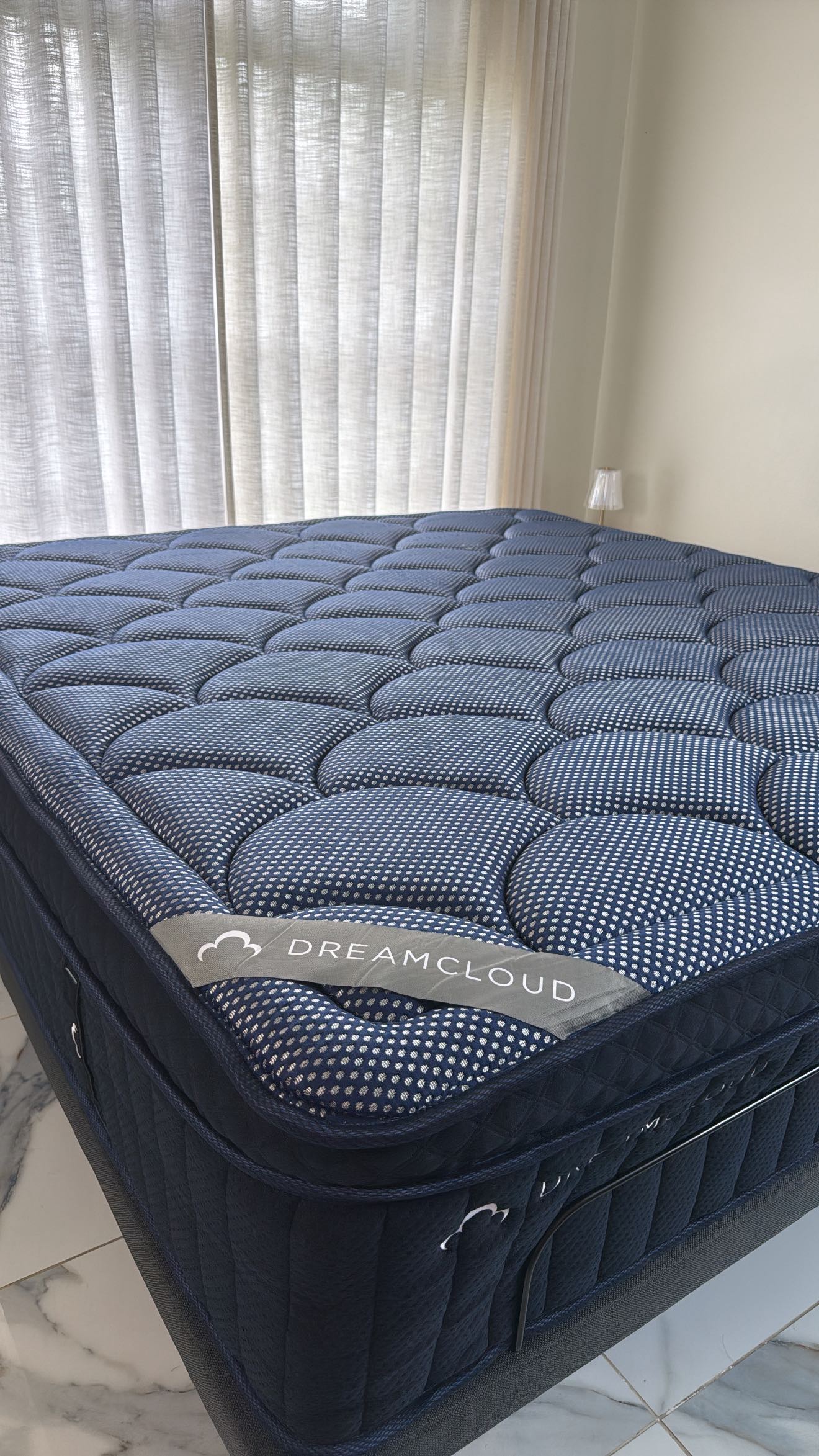 Instagram post by @hellodrezza for DreamCloud Sleep. Caption reads: #ad 

Welcome to lazy girl summer: where the
AC is....