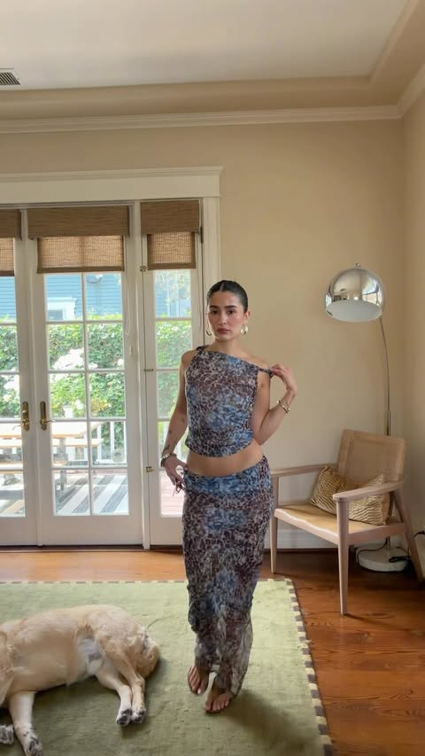 Instagram post by @anibaaaby for REVOLVE. Caption reads: sheer skirt summer @revolve #revolvepartner.