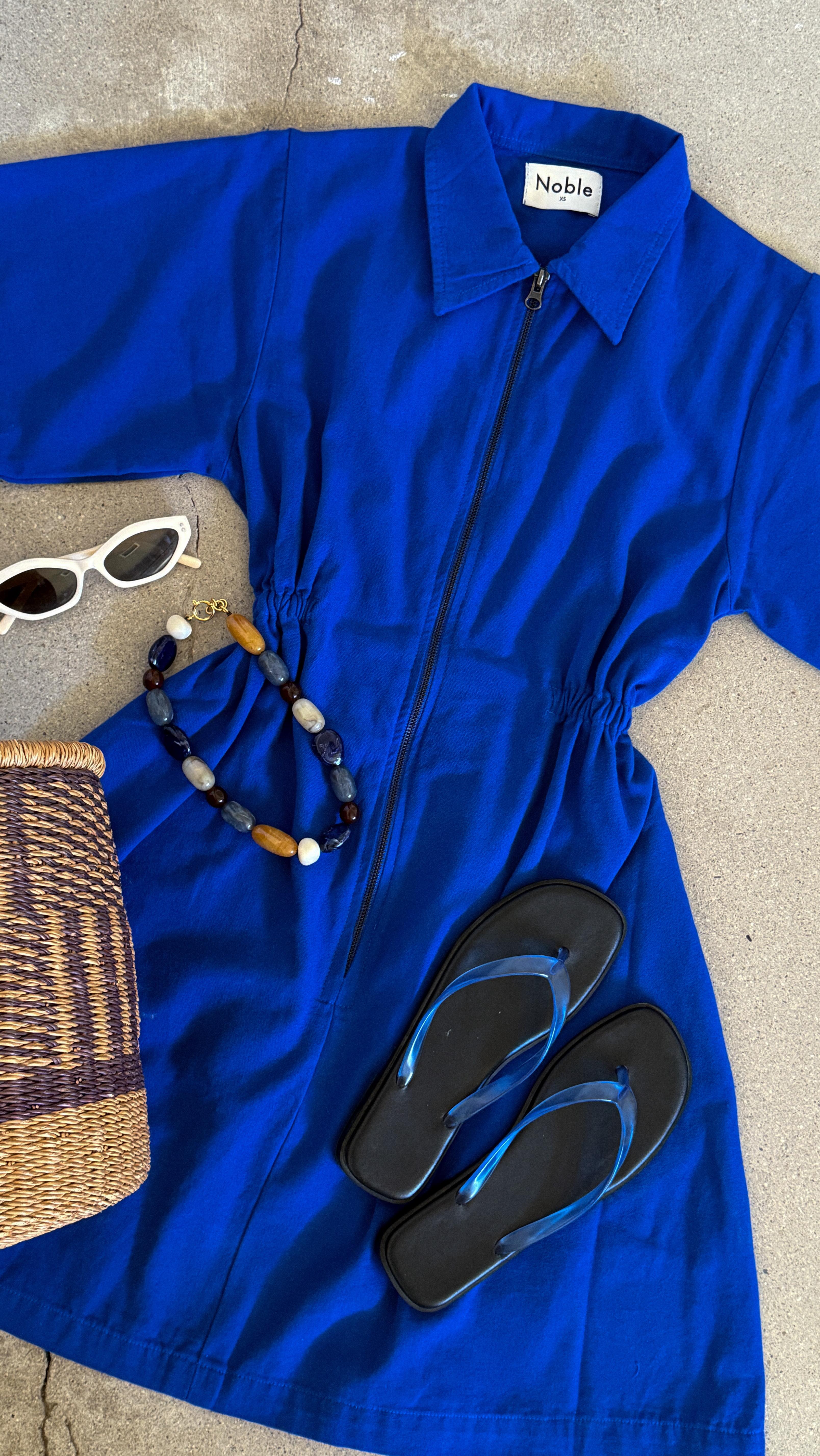 Instagram post by @yslnc for Shop Noble. Caption reads: [...] versatile, go-to choice.

Wearing the....