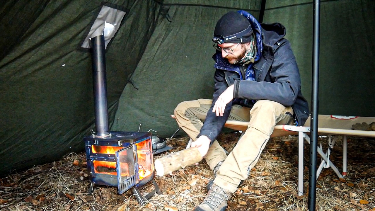YouTube post by @Bushcraftowy for E-Militaria. Caption reads: - 4'C - Frosty night in the forest solo - this....