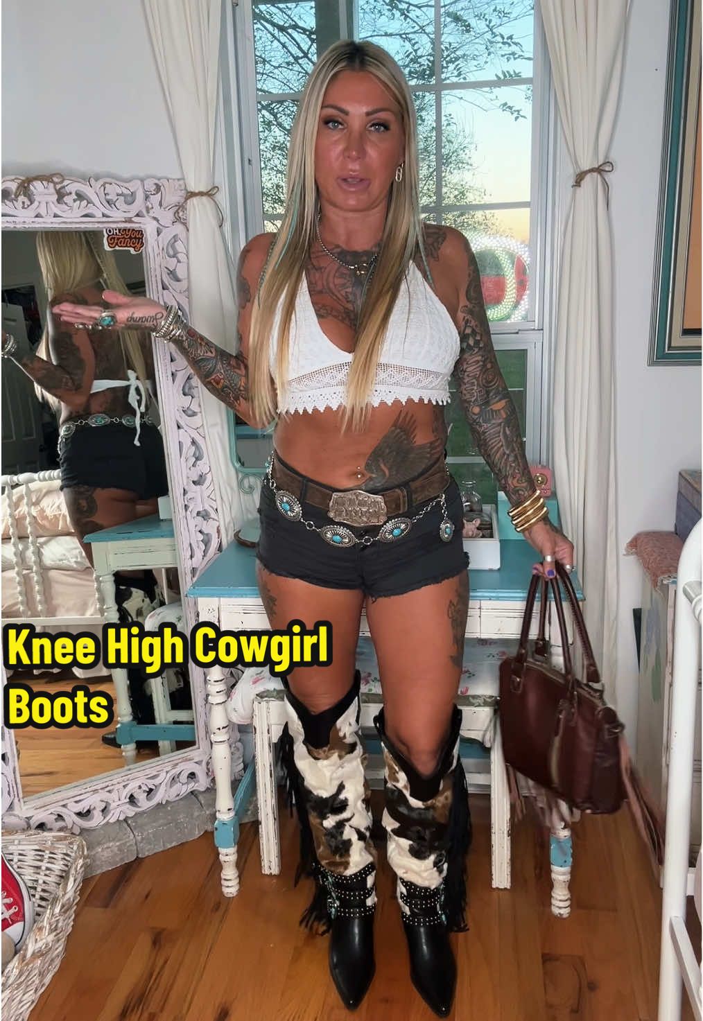 TikTok post by @nattymctatty1981 for AZALEA WANG. Caption reads: Cowgirl Boots… like cow… they have cow print!!!😂....