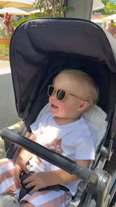 Instagram post by @asha.verrall for Polarised Baby Sunglasses. Caption reads: @bukibabysunglasses polarised sunnies are a must!....