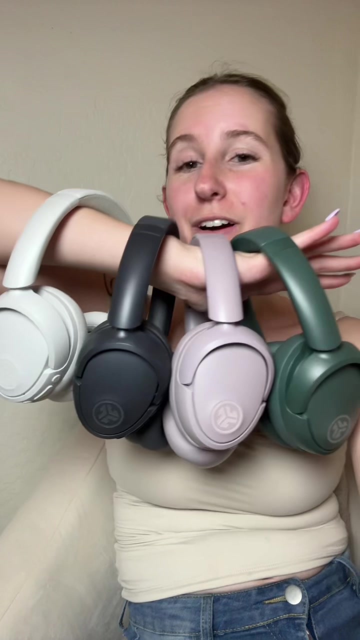 TikTok post by @raisingbabyt for JLab. Caption reads: [...] headphones are on SALE 🎧 ! @JLab #jlab....