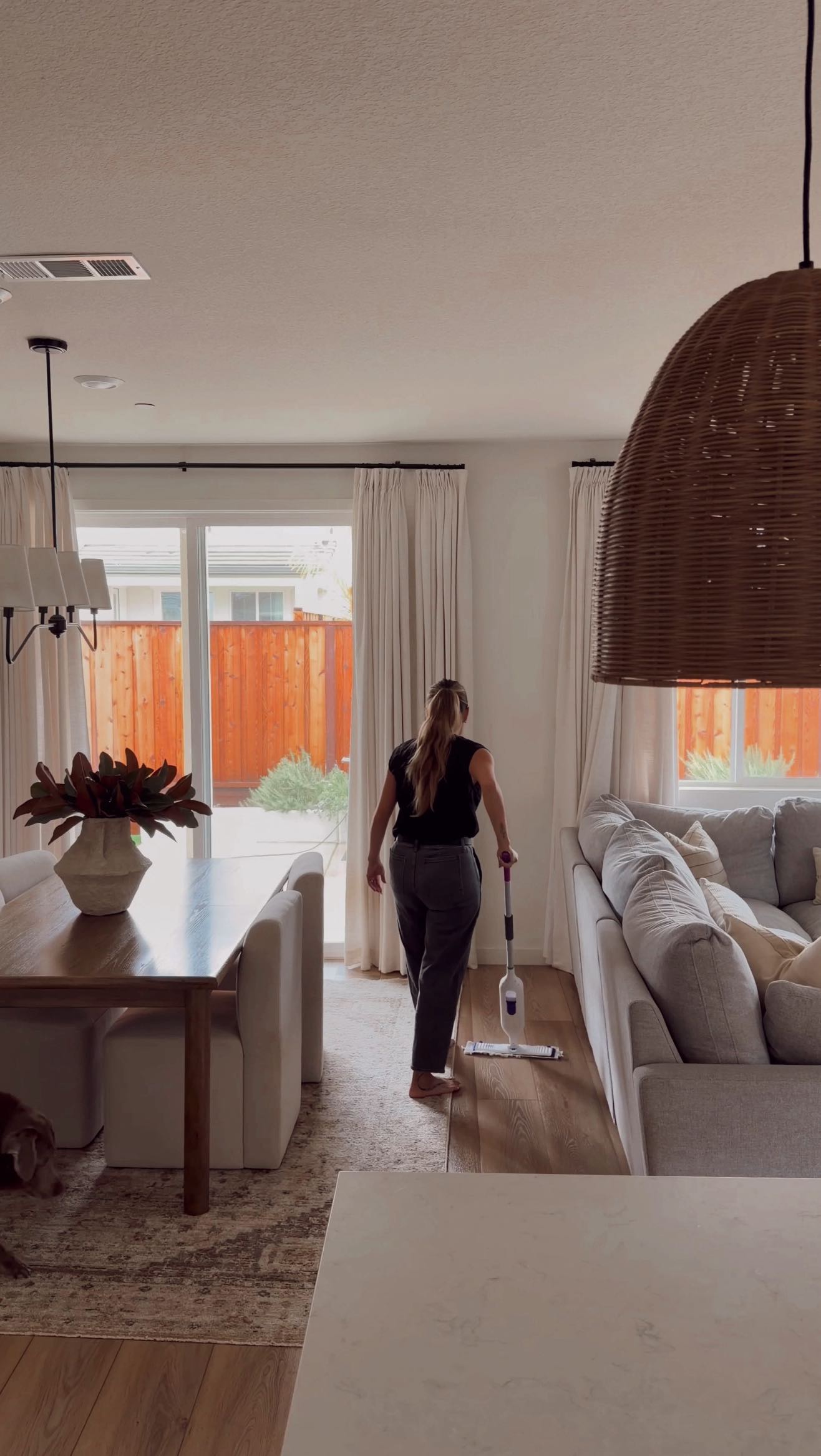 Instagram post by @destination_home for Swiffer. Caption reads: The @swiffer PowerMop is my cleaning must have....