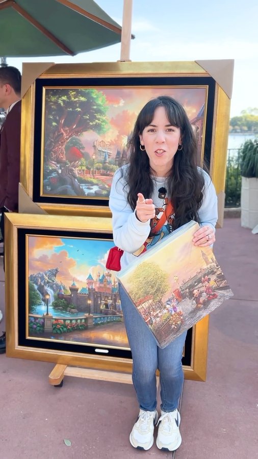 Instagram post by @mainstreetorlando for Thomas Kinkade Studios. Caption reads: AD| Thomas Kinkade Studios at Epcot’s Festival of....