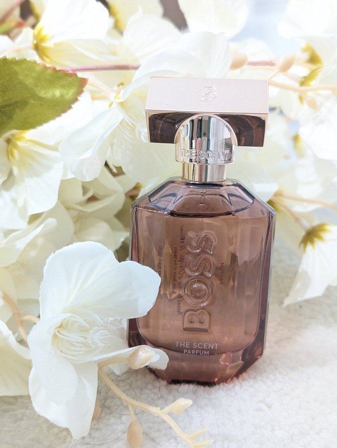 Instagram post by @vanessa93_x for The Perfume Shop. Caption reads: 🍊Bold. Captivating. Unmistakable. 🧡 
I was....