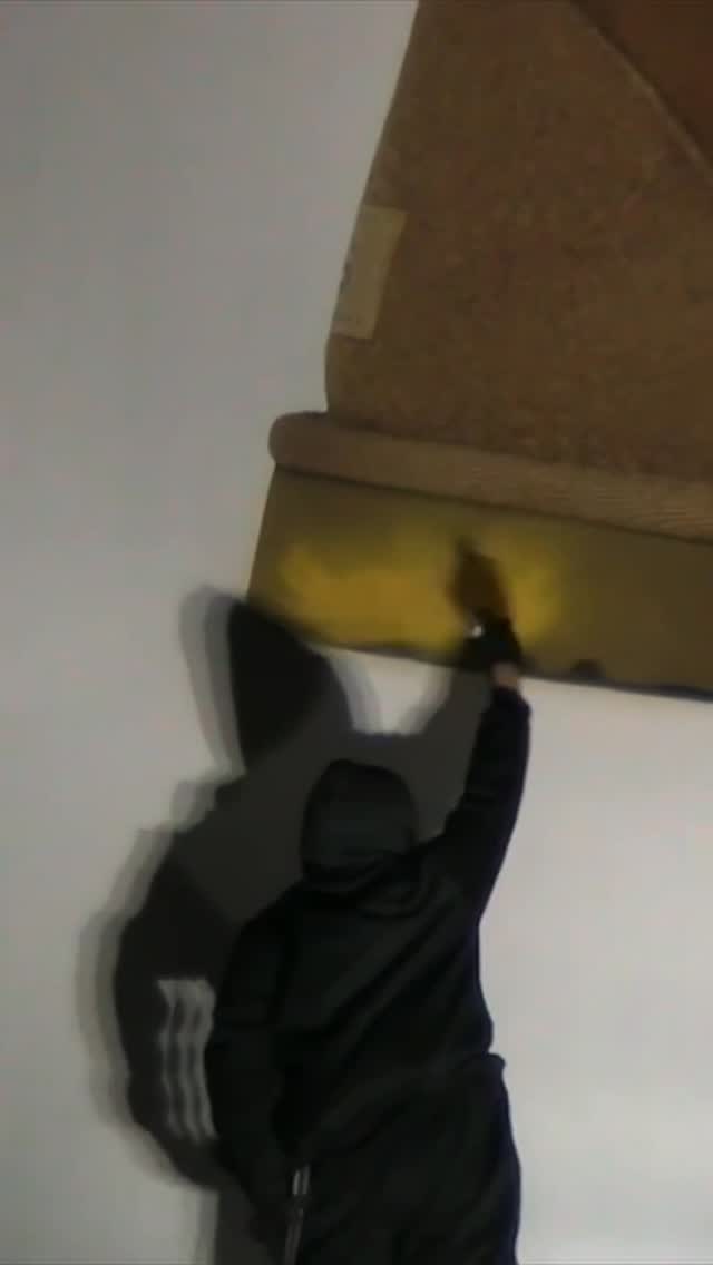 Instagram post by @liljupiterr for UGG. Caption reads: Someone just spray painted on an oversized UGG....