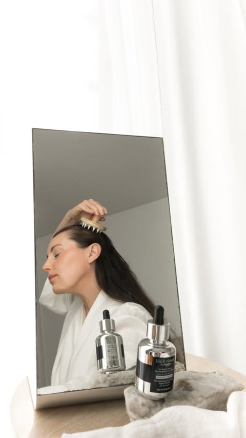 Instagram post by @helendriscoll_ for Hair Rituel by Sisley. Caption reads: [...] massaging 3 pipettes of the....