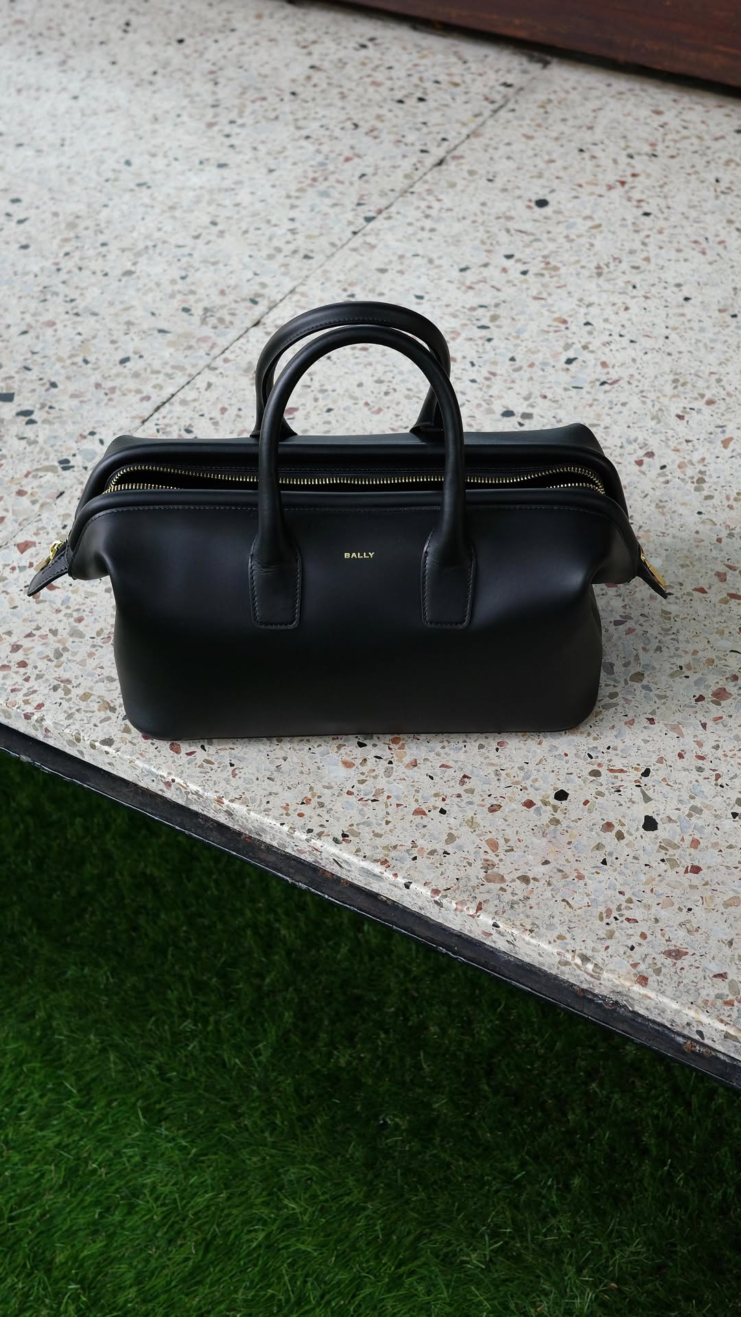 Instagram post by @olivialazuardy for Bally. Caption reads: Doctor’s orders: Keep it chic and organized! 🩺✨....