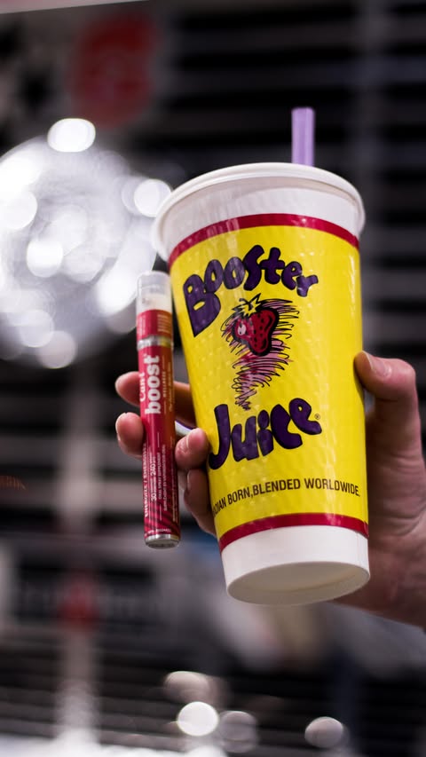 Instagram post by @caniwellness for Booster Juice. Caption reads: [...] with Can-i Boost at your local Booster....