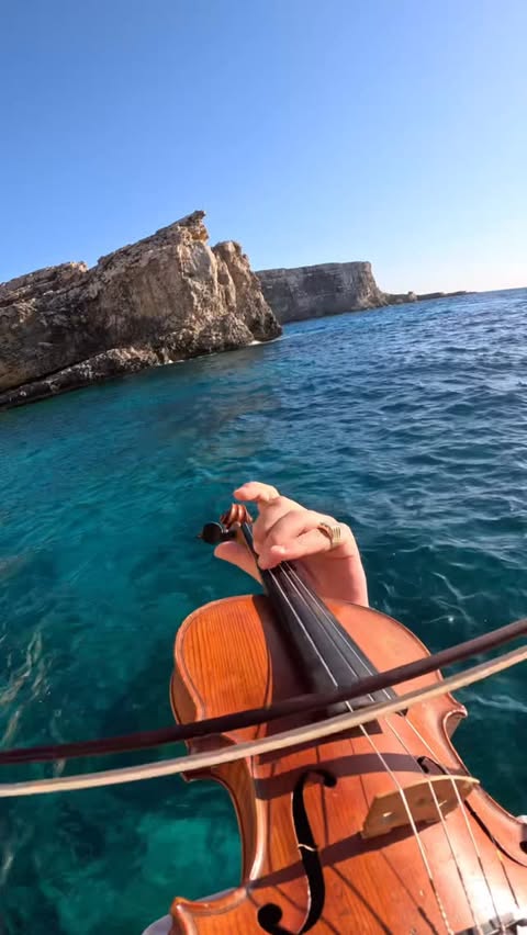 Instagram post by @poviolinist for VisitMalta. Caption reads: [...] like Brook in Malta 🇲🇹 BLUE LAGOON....