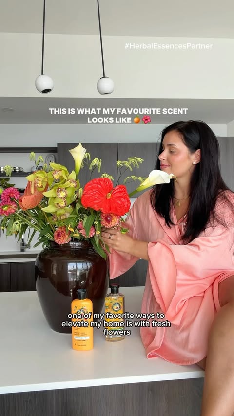 Instagram post by @natdoumkos for Herbal Essences. Caption reads: #HerbalEssencesPartner bringing a little tropical....