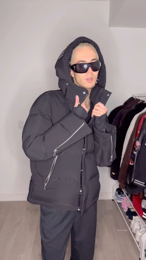 Instagram post by @joewoahy for RUDSAK. Caption reads: all black fit wearing my new @rudsak puffer 😎....