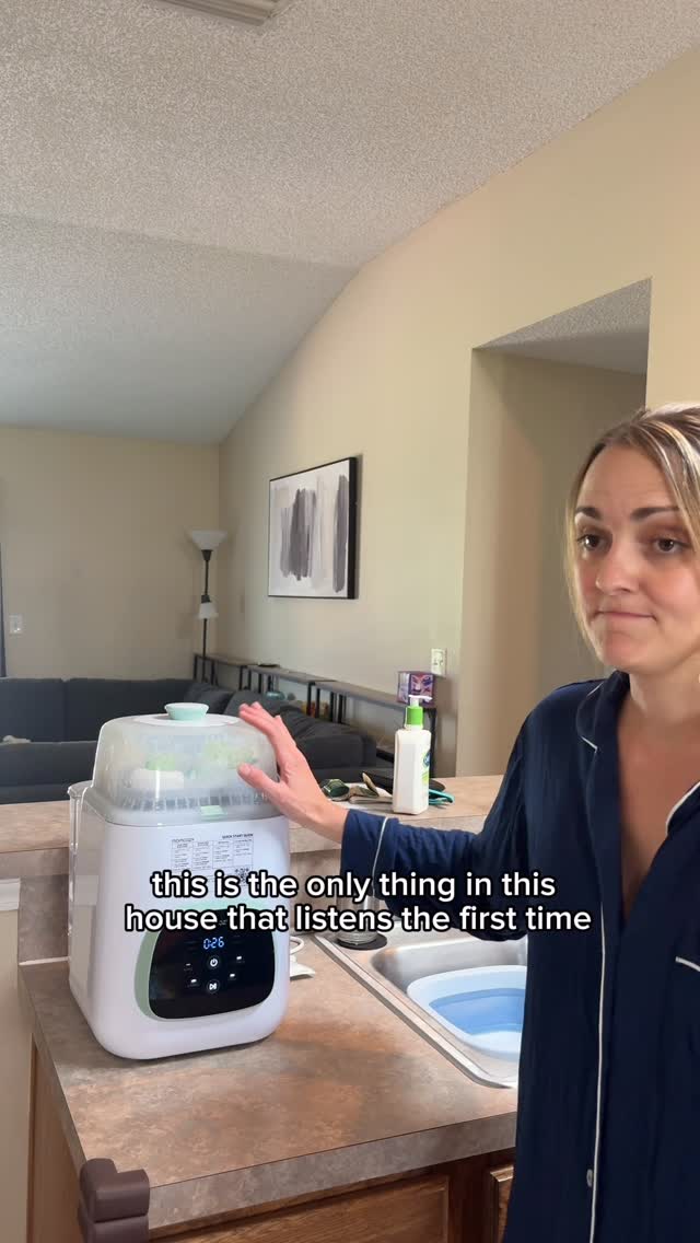 Instagram post by @_brittany_depalma_ for Momcozy. Caption reads: Not all heroes wear capes-mine sprays hot water....