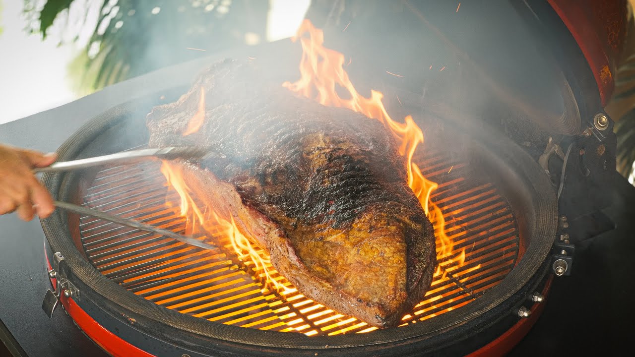 YouTube post by @PITMASTERX for Kamado Joe. Caption reads: Hot and Fast Brisket.