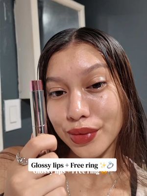 TikTok post by @carriepartida04 for Timephoria Store. Caption reads: Glossy lips and free ring ✨💍 @Timephoria US Store....