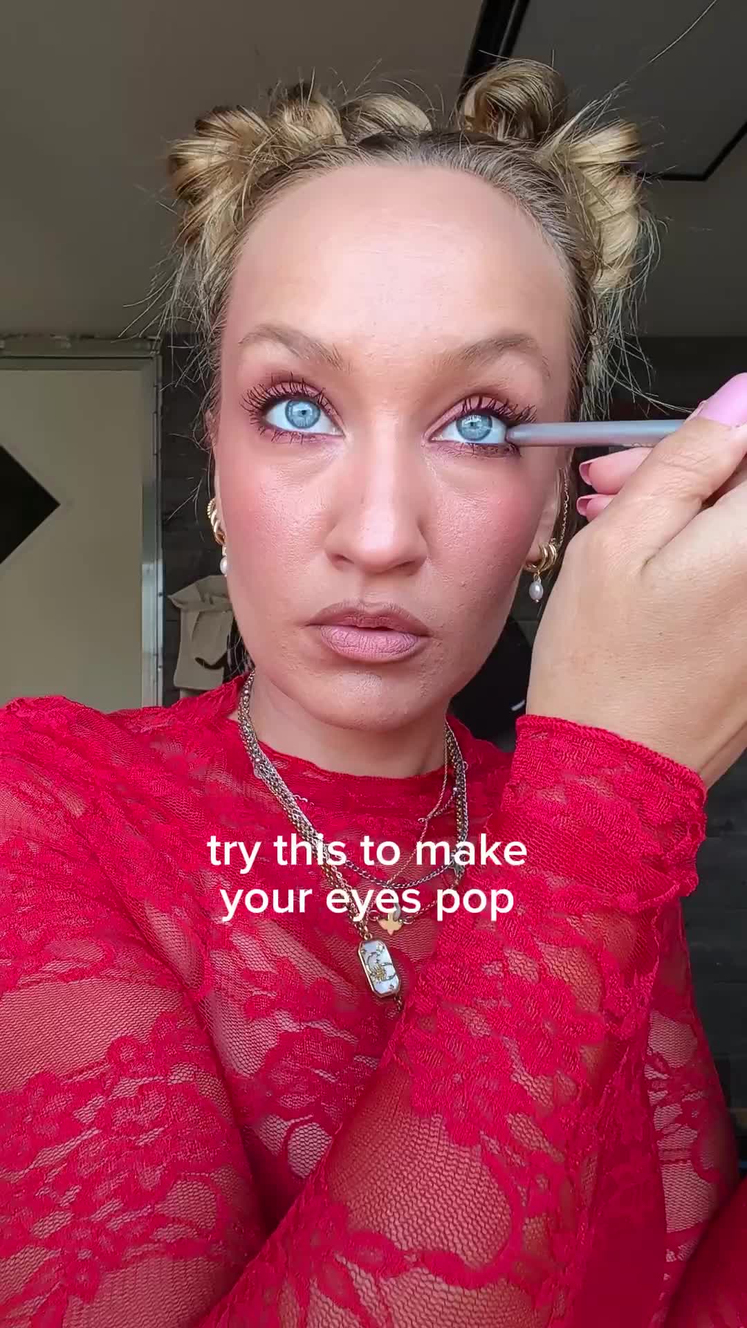 TikTok post by @savannahmoore406 for Page Vine. Caption reads: @KCTAN Studio 🎀 #blueeyes #eyeliner.