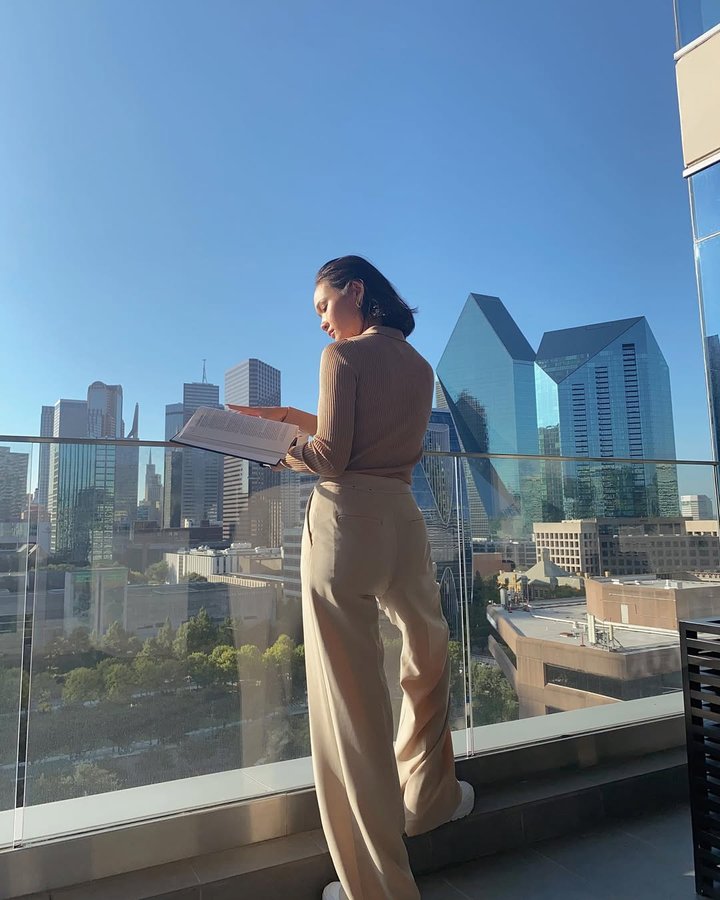 Instagram post by @averiebishop for WeWork. Caption reads: Welcome to my new downtown office & study view....