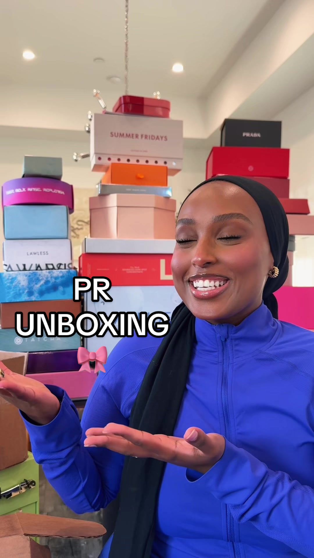 TikTok post by @ayshaharun for DEZI. Caption reads: First PR unboxing of the yeeeeaaarrr!! 😍📦🎀....