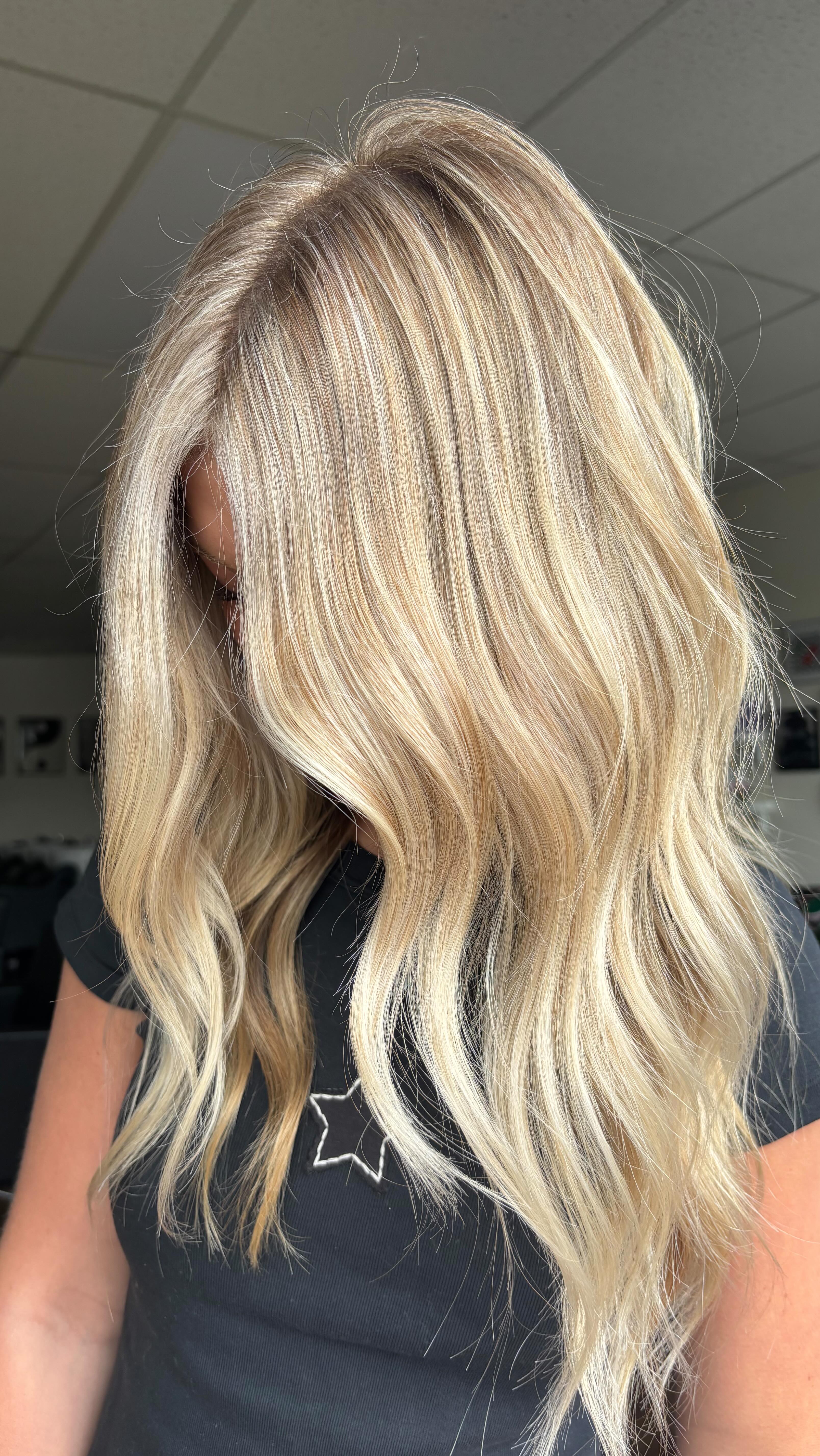 Instagram post by @taylorhartmann_hair for Framar. Caption reads: this tone is a perfect mix of warm & cool 💫🥂....