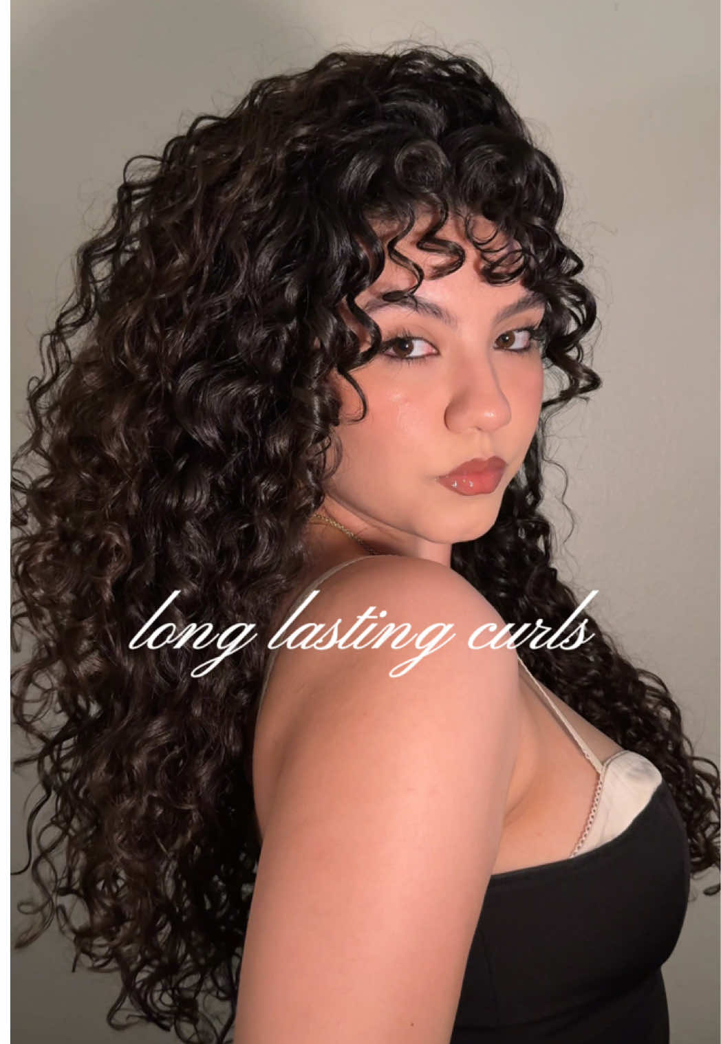TikTok post by @13rianda for KISS Colors & Care. Caption reads: My favorite routine for long-lasting curls🤍The....