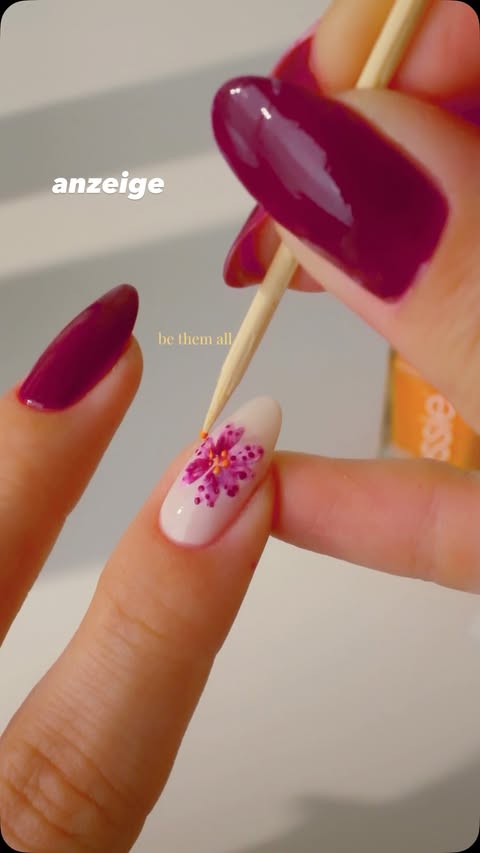 Instagram post by @basecoatstories for essie. Caption reads: anzeige • ad // summer flower nails with @essie....