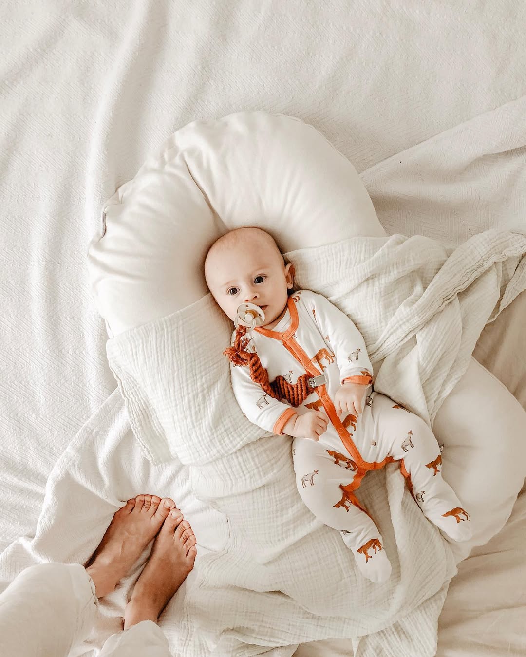 Instagram post by @loeppkyslife for Kyte Baby. Caption reads: Fresh sheets, a snuggly babe, and quiet afternoon.....