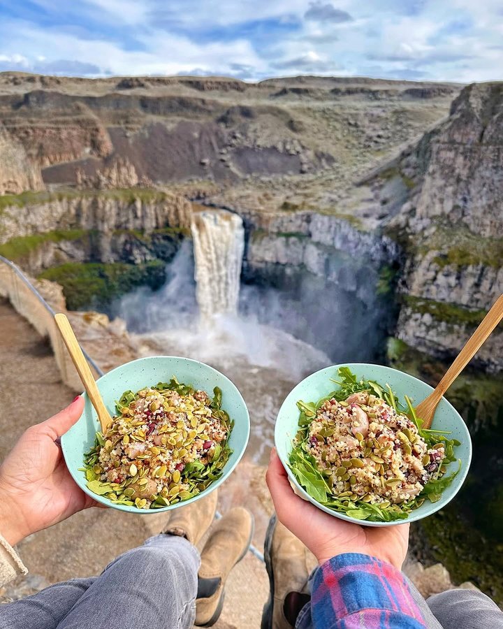 Instagram post by @wanderlusttravelcouple for SIMPLi. Caption reads: [...] Plant Powered Protein Bowl made with....