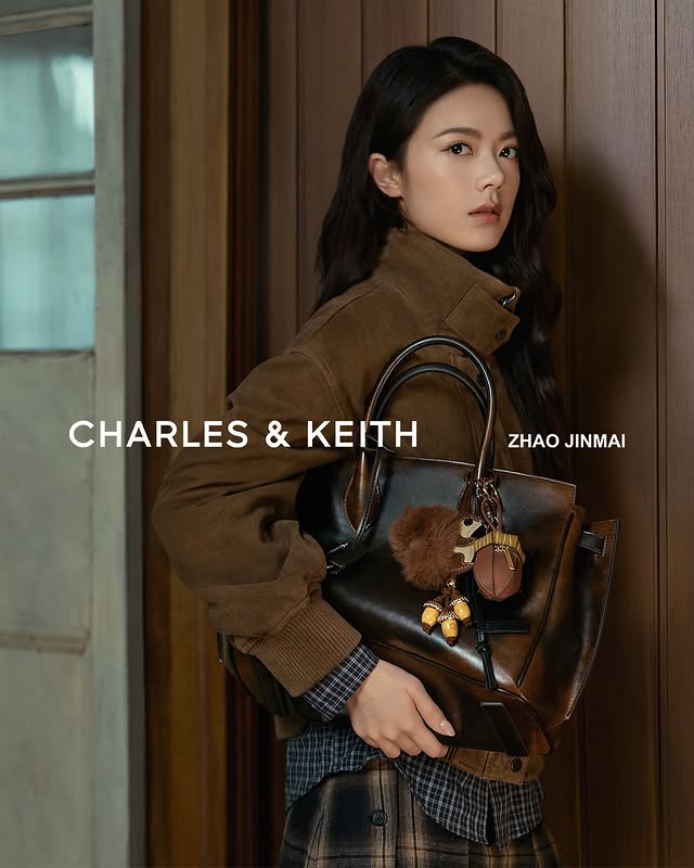 Instagram post by @jinmai_z for CHARLES & KEITH. Caption reads: CHARLES & KEITH welcomes Zhao Jinmai to the family....