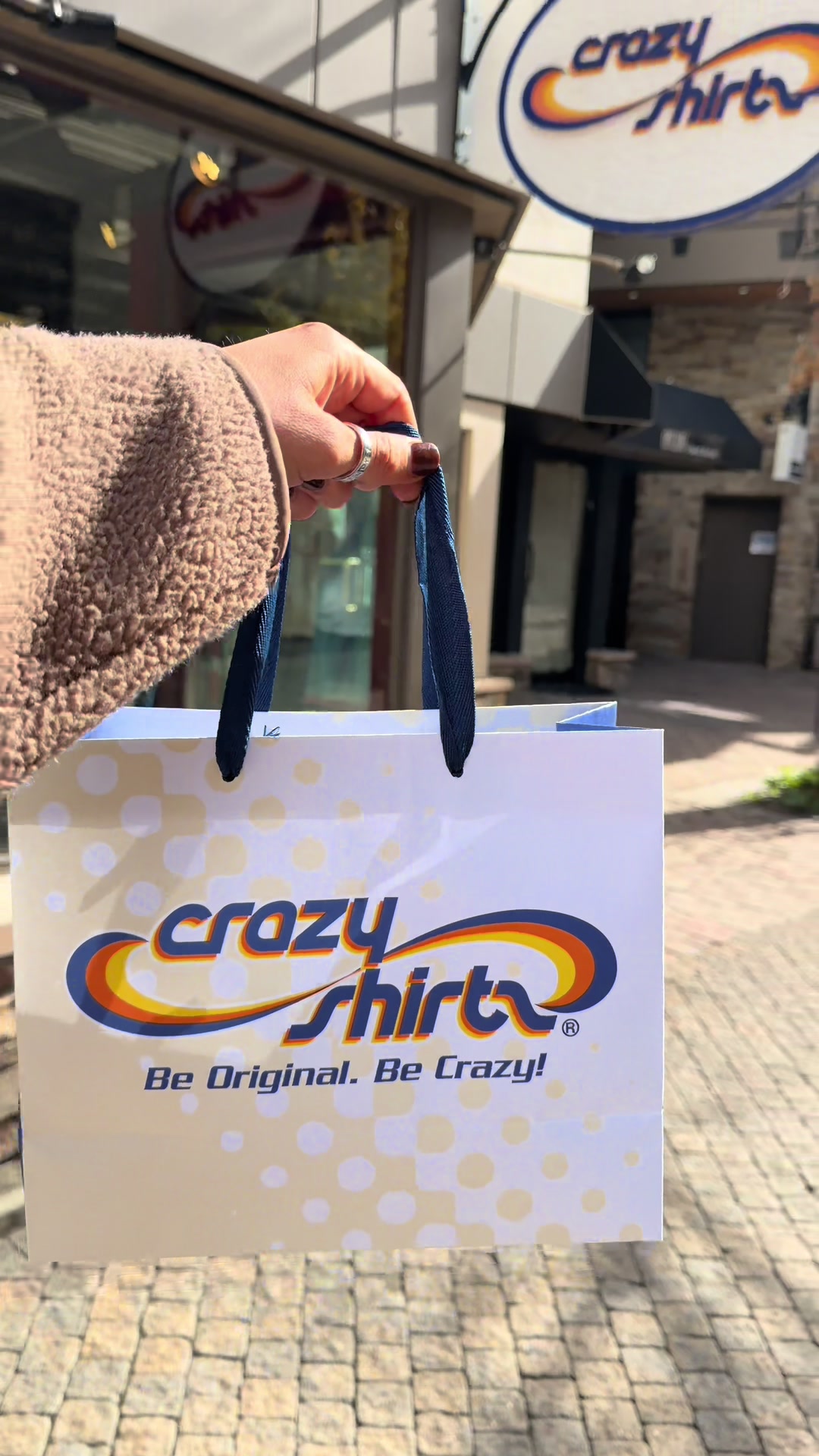 TikTok post by @lindydawn__ for Crazy Shirts. Caption reads: I’m a stay at home mom near Denver who hates....