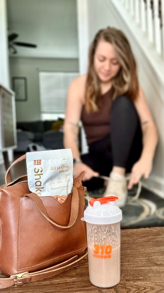 Instagram post by @audreyinwanderlust_ for 310 Nutrition. Caption reads: #ad Balancing mom life, work life and school life....