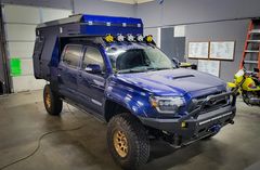 Instagram post by @badassbrunette for Battle Born Batteries. Caption reads: Show Time! Be sure to stop by the....