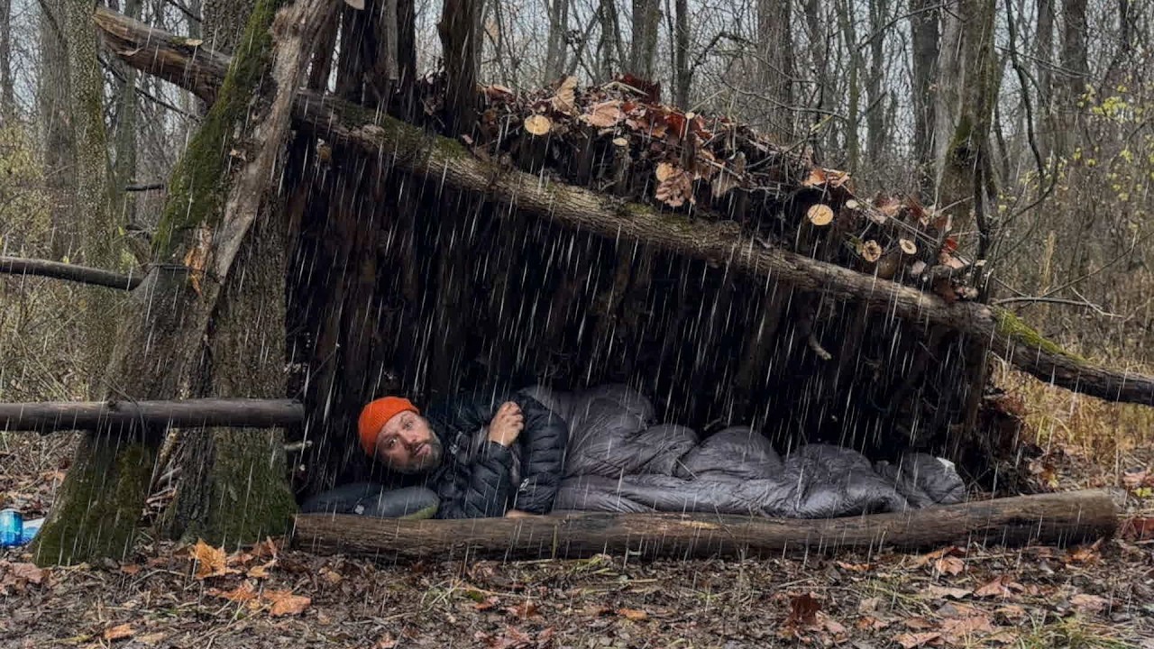 YouTube post by @CampingwithSamBananas for Suunto. Caption reads: Will my Bushcraft Shelter Stand up to the Rain?.