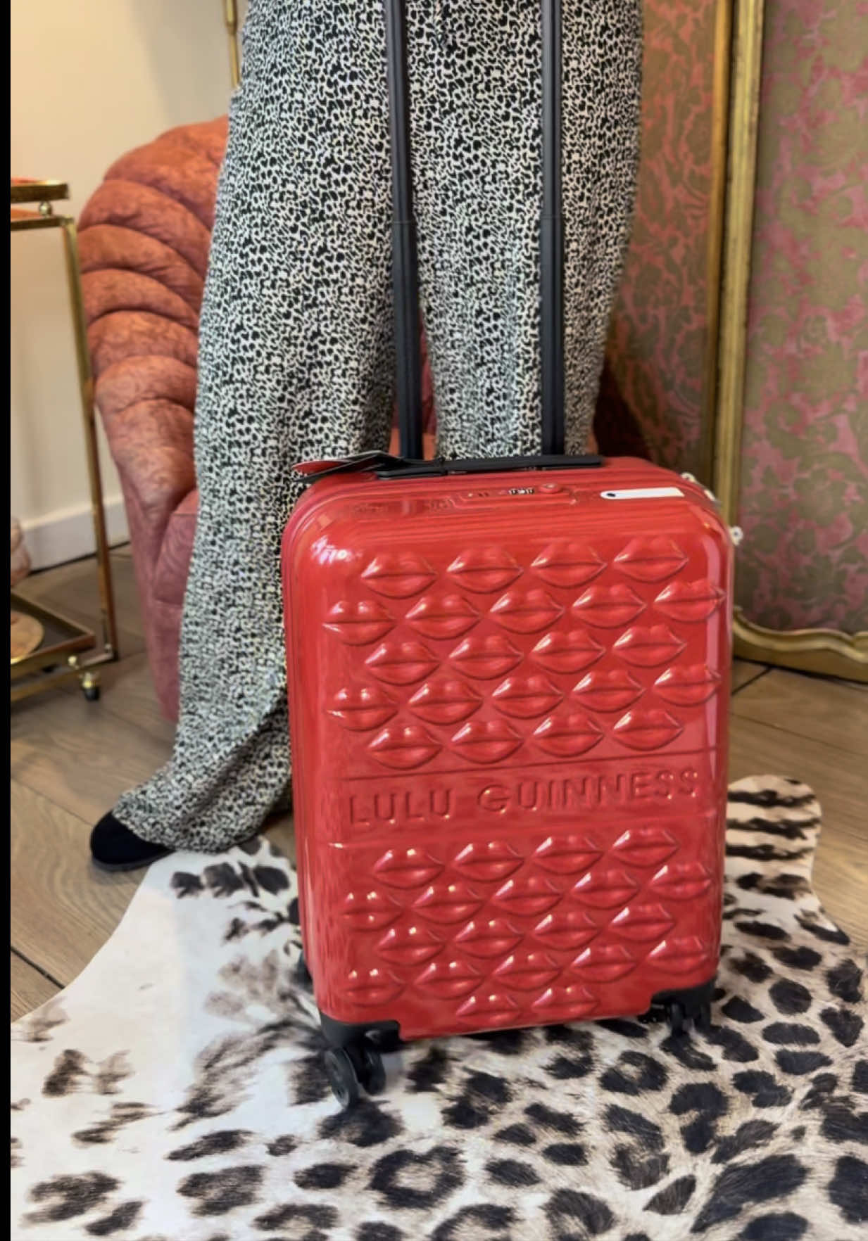 TikTok post by @thevanitycase for Lulu Guinness. Caption reads: [...] my new most stylish travel companion @Lulu....