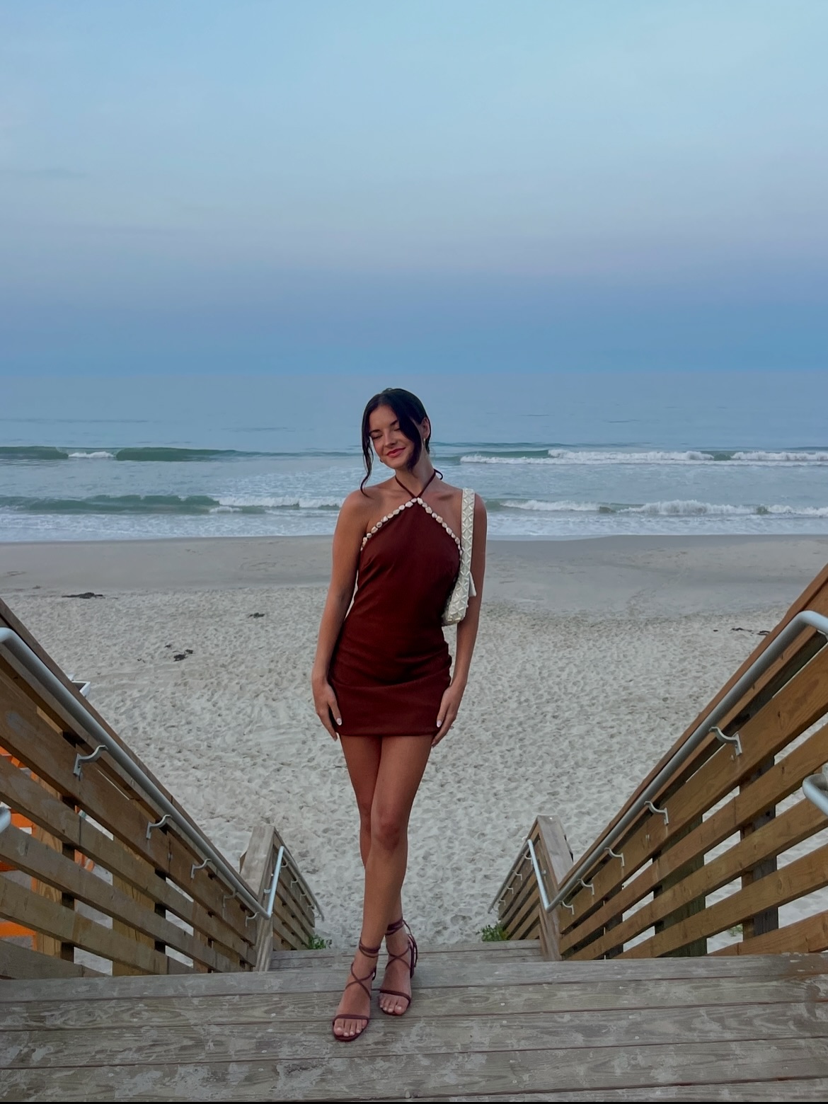 Instagram post by @brookehyland for Lulus. Caption reads: “The outer banks, paradise on earth” 🌞🌊🤎🐚....
