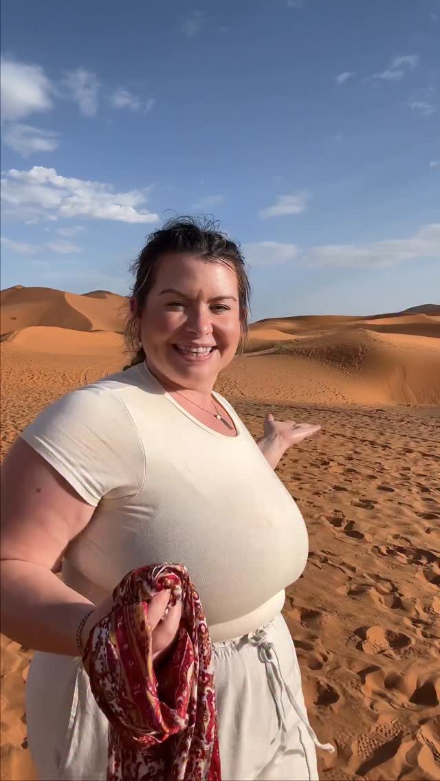 Instagram post by @hannahzaslawski for Intrepid Travel. Caption reads: Headscarf tutorial in the Sahara desert. Honestly....