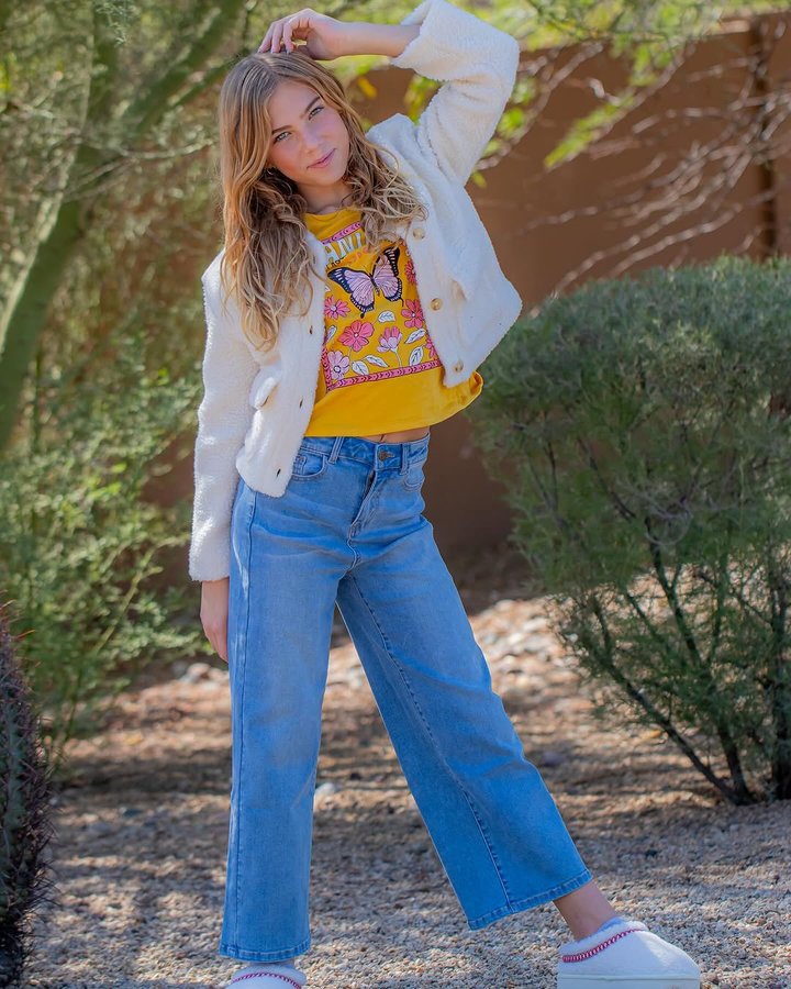 Instagram post by @henley.alexa for FabKids. Caption reads: #ad Free fall in' into @fabkids 🍁 The coziest....